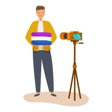 Smiling man holding stack of clothes recording video blog using camera on tripod Illustrazione stock