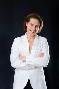 Smiling man macho in white jacket Stock Photos