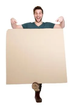 Smiling man pointing finger down Stock Photos
