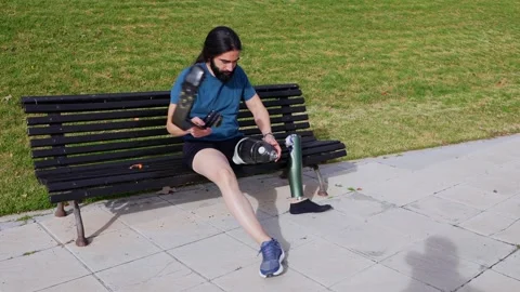 Smiling Man with Prosthetic Leg Ready for a Workout in the Park Stock Footage 264035489