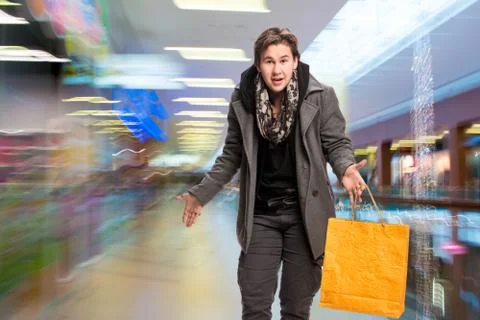 Smiling man with shopping bags Stock Photos