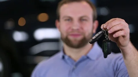 Smiling man showing car keys Stock Footage 70342185