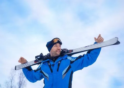 Smiling man with a ski make having rest before next downhill skiing. Stock Photos