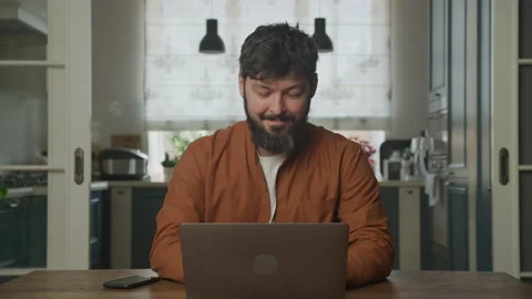 Smiling man studying on a computer laptop 動画素材 201199983