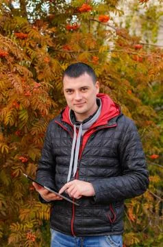 The smiling man with the tablet Stock Photos