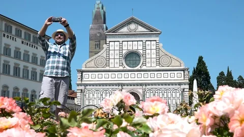 Smiling man taking selfie in front of Santa Maria Novella church, Florence Italy Video stock 106362795