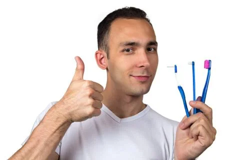 Smiling man with toothbrushes Stock Photos