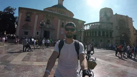 Smiling Man Twirling Round On Crowded In Valencia Square Slow Motion Video stock 84889580