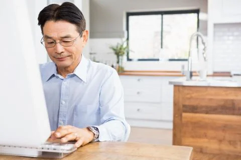 Smiling man using computer Stock Photos
