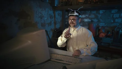 Smiling Man Using Desktop Computer at Night Stock Footage 340483387