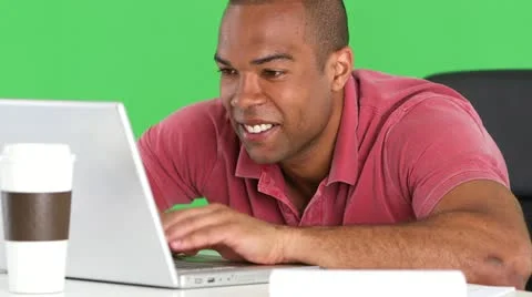 Smiling man using laptop at desk Video stock 11859150