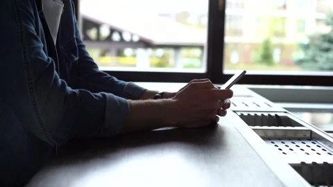 Smiling man using smartphone. Handsome person spending leisure time with gadget Stock Footage 155331303