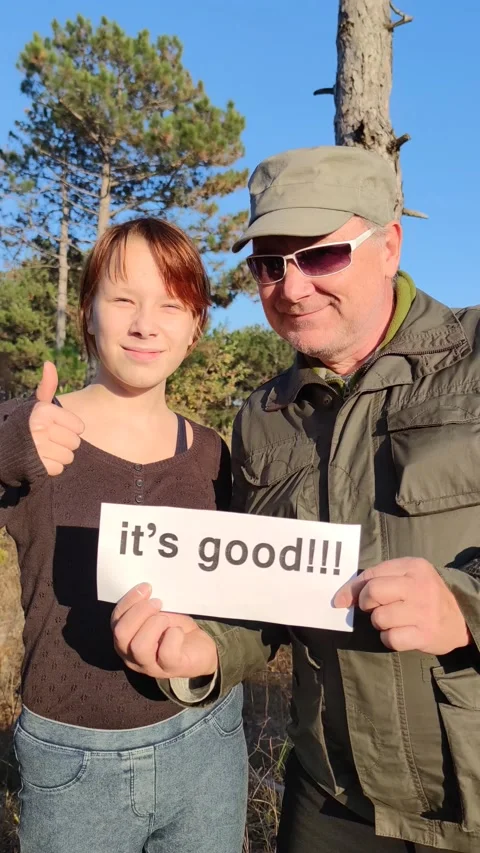 A smiling man waving his hand invitingly and showing the text "it's good" Stock Footage 164550218