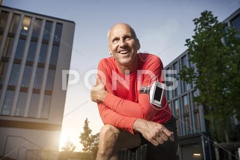 Smiling mature athletic man outdoors Stock Photos