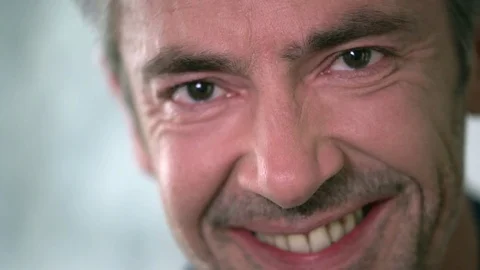 Smiling mature man looking at camera Stock Footage 74181797