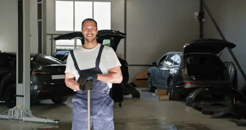 Smiling Mechanic Standing in Modern Car Repair Workshop Stock Footage 277216042