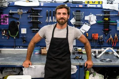 Smiling mechanic standing in workshop Stock Photos
