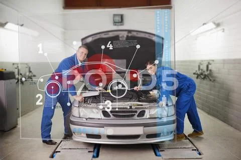 Smiling mechanics consulting futuristic interface Stock Photos
