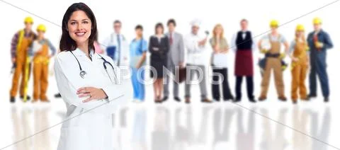 Smiling medical doctor over workers group. Stock Photos