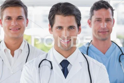 Smiling medical team standing Stock Photos