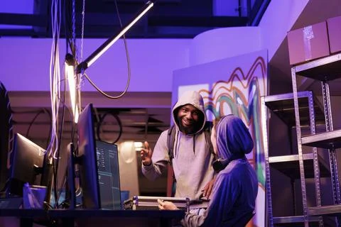 Smiling men discussing hacking plan Stock Photos