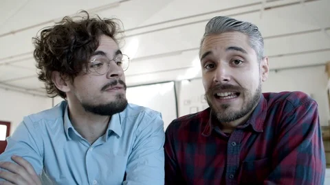 Smiling men having video call through laptop Stock Footage 121403360