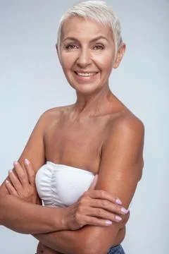 Smiling middle aged lady looking into camera Foto stock