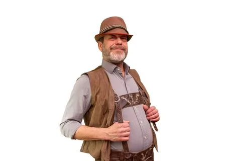 Smiling middle aged man in rustic hat and traditional vest isolated Fotos de archivo