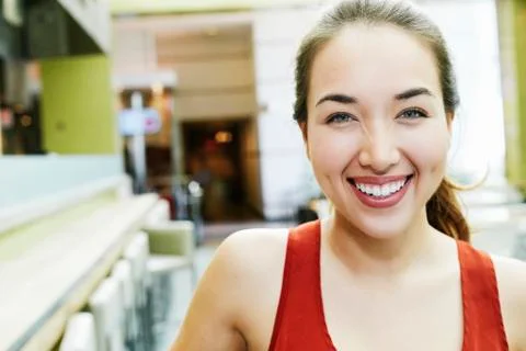 Smiling Mixed Race woman posing in food court Stock Photos