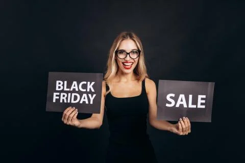 Smiling Model Announcing Insane Black Friday Discounts Stock Photos