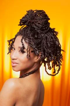 Smiling model on orange background Stock Photos