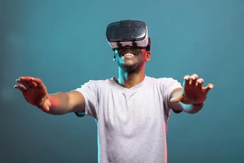 Smiling Model Using VR Headset Stock Photos