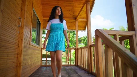 Smiling model walks gracefully on the cabin deck Video stock 301443260
