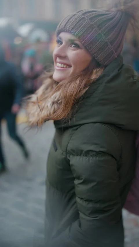 Smiling modern 40 years old woman at winter fair in city Stock Footage 258871896