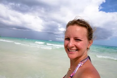 Smiling naturally at the beach Stock Photos