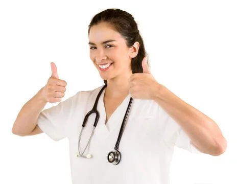 Smiling nurse with thumbs up posing Foto stock