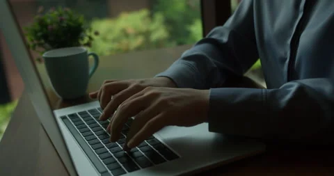 Smiling office worker typing on a computer in the office. Woman working in an Stock Footage 307864950