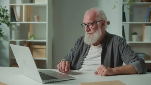 A Smiling Old Man Communicates Via Video Call Stock Footage 250301756