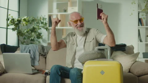 A Smiling Old Man in the Funny Glasses Happy about His Future Trip. Stock Footage 249712302