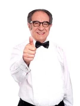 Smiling old man gesturing thumbs up Stock Photos