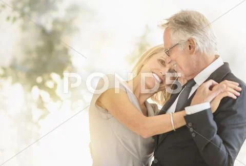Smiling Older Caucasian Couple Dancing