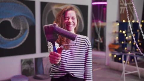 A smiling painter is standing with tools and looking at the camera Stock Footage 155241592