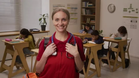 Smiling Paramedic Looking at Camera Posing in School Stock Footage 328324645
