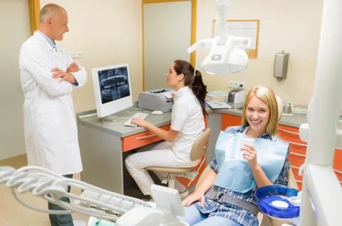Smiling patient at dentist surgery Stock Photos