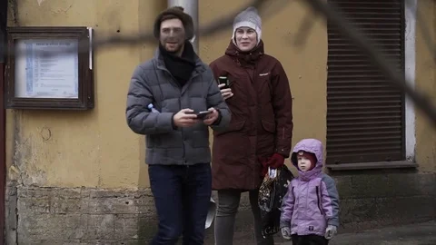 Smiling pedestrians taking photo using smartphone at city street Stock Footage 84931449