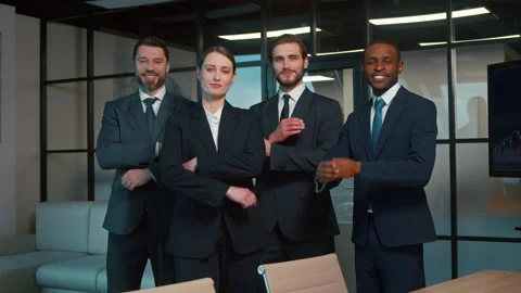 Smiling people in a suit in the office. Business people looking at camera. Close Stock Footage