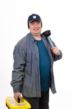 Smiling plumber holding toolbox 库存照片