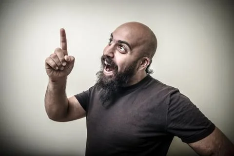 Smiling pointing bearded man Stock Photos