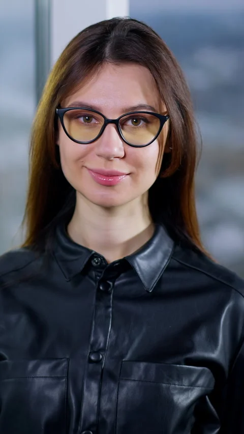 Smiling positive dark-haired lady puts off her glasses 스톡 동영상 297414667