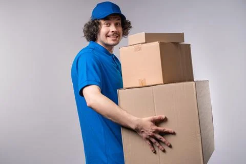 Smiling Postal Courier, Porter Man With Parcel Box. Happy Handyman Delivering Stock Photos